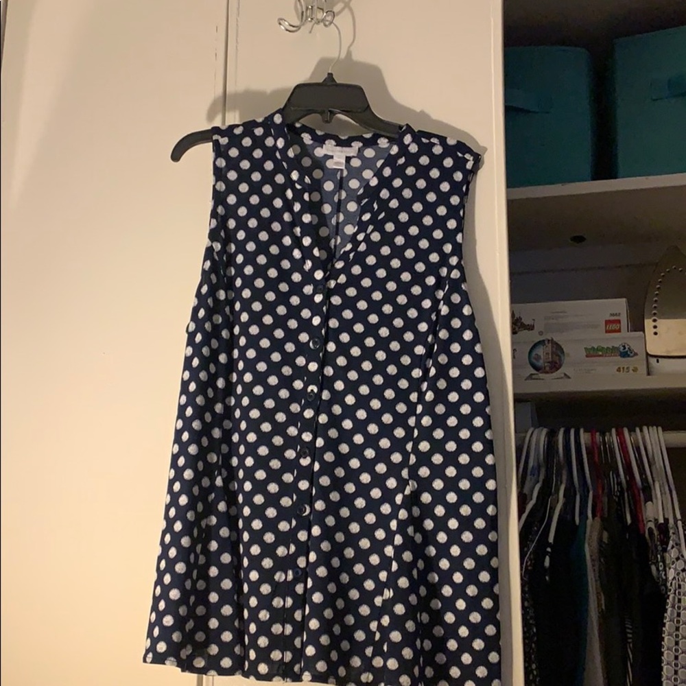 New sleeveless blue shirt with white dots.